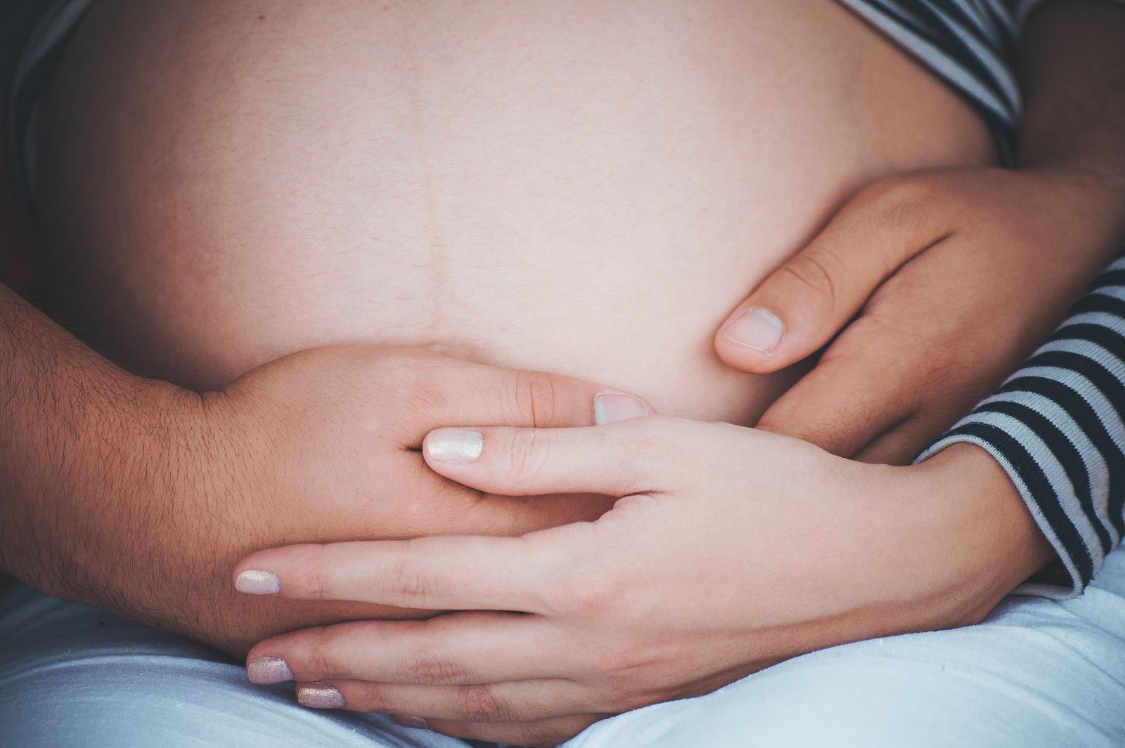 hands on belly of pregnant women